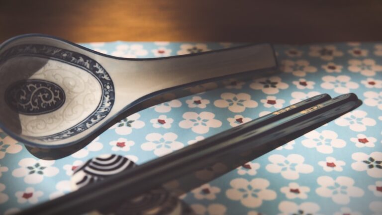 ：chopsticks on a ceramic hashioki rest at a japanese table