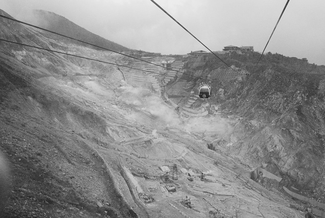 :hakone ropeway gondola crossing the volcanic valley at owakudani