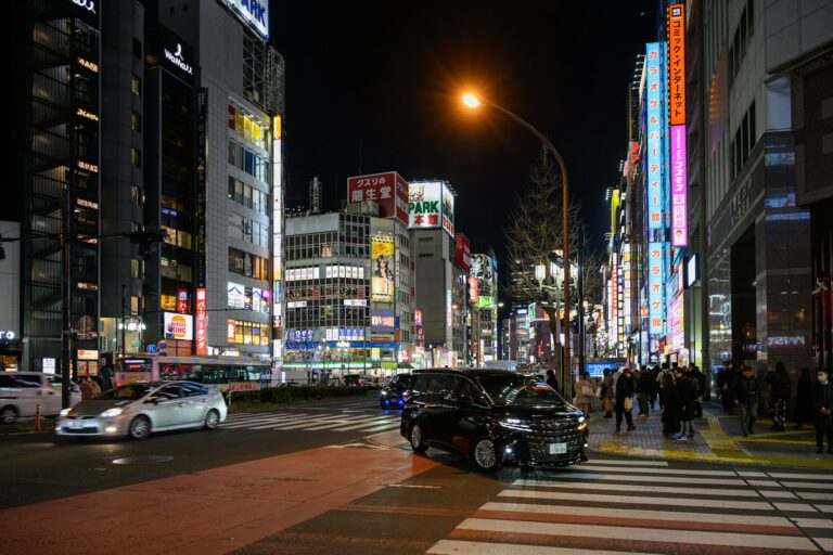 Nighttime cityscape with bright lights and traffic