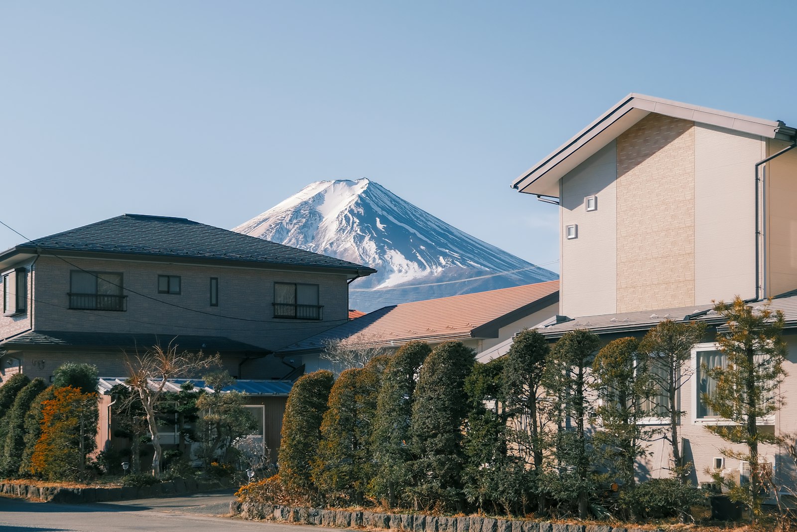 a house with a mountain in the background