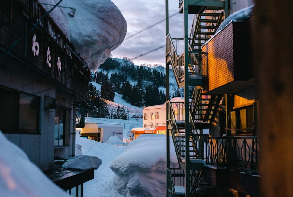 ：wooden soto-yu bathhouse in the snow at nozawa onsen village