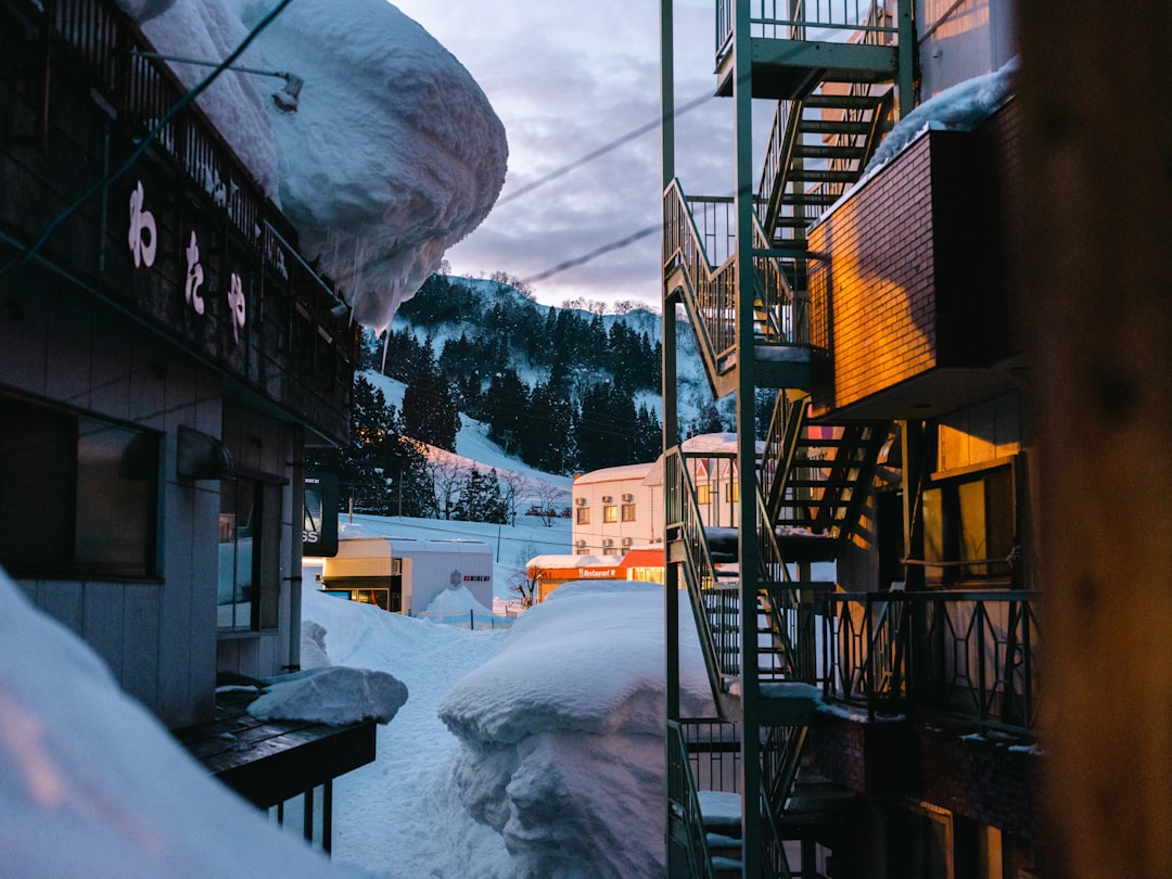 :wooden soto-yu bathhouse in the snow at nozawa onsen village