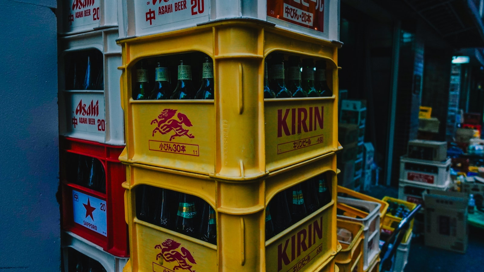 Stack of yellow kirin beer crates with bottles