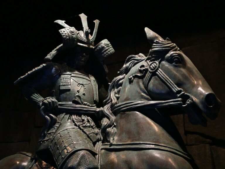 A bronze statue of a samurai warrior on horseback