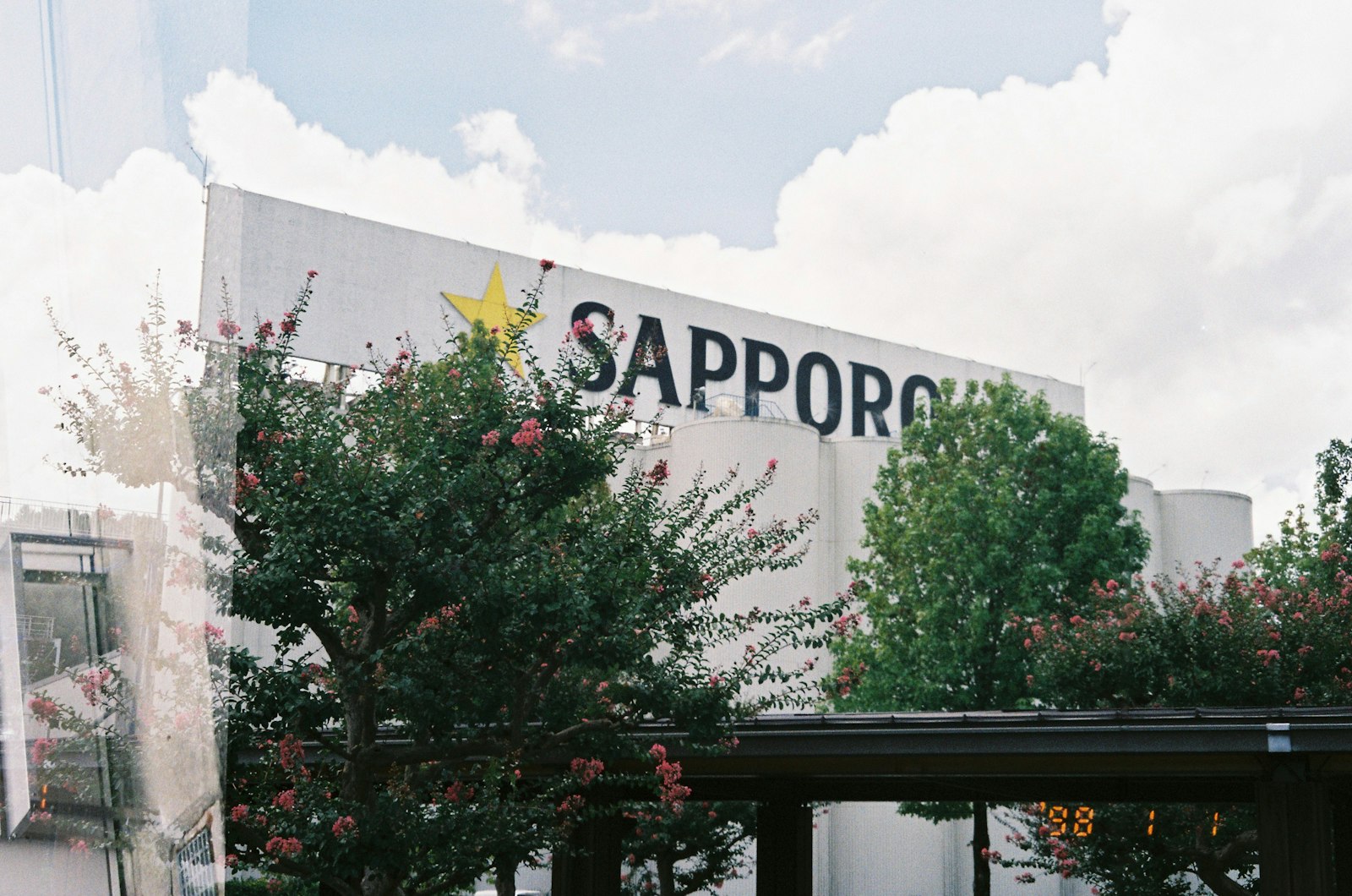 Sapporo building with trees and clouds