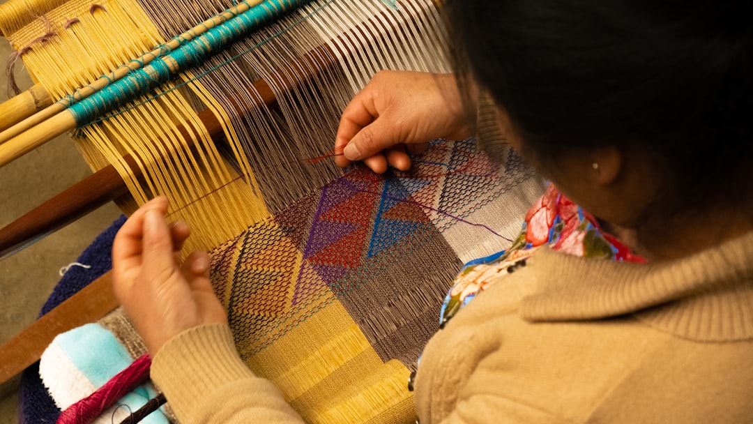 ：weaving oshima tsumugi silk on a loom in amami