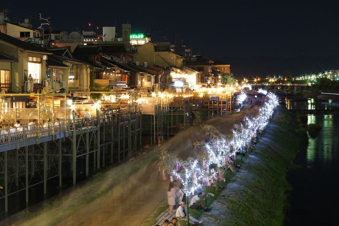 :noryo yuka dining platforms over the kamo river on a kyoto summer evening