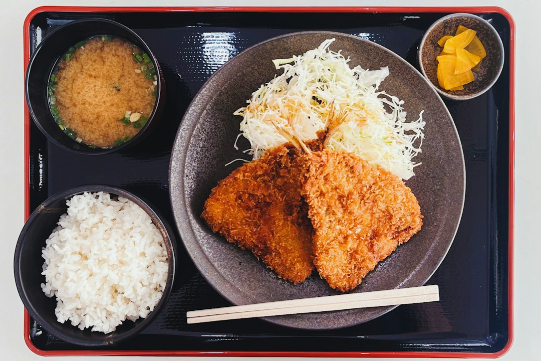 ：menchi katsu and croquettes sold at a counter on yanaka ginza