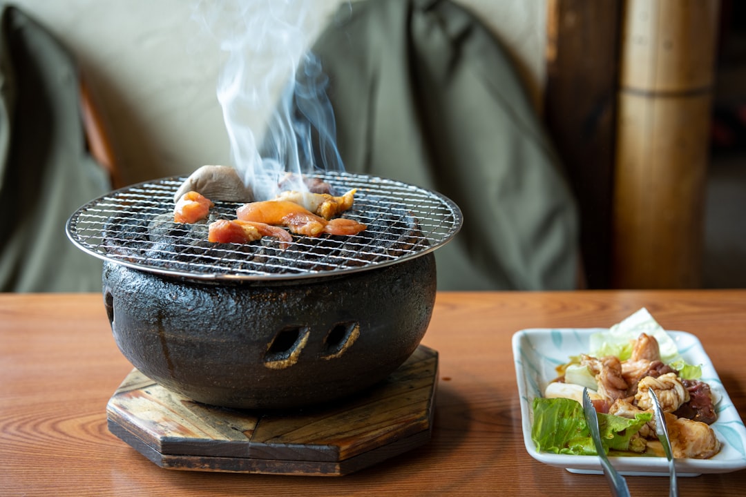 :grilled scallops at a stall in kuromon market osaka