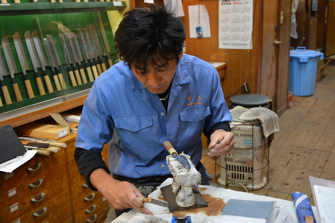 :child searching for fossils at the outdoor dig site near the fukui dinosaur museum