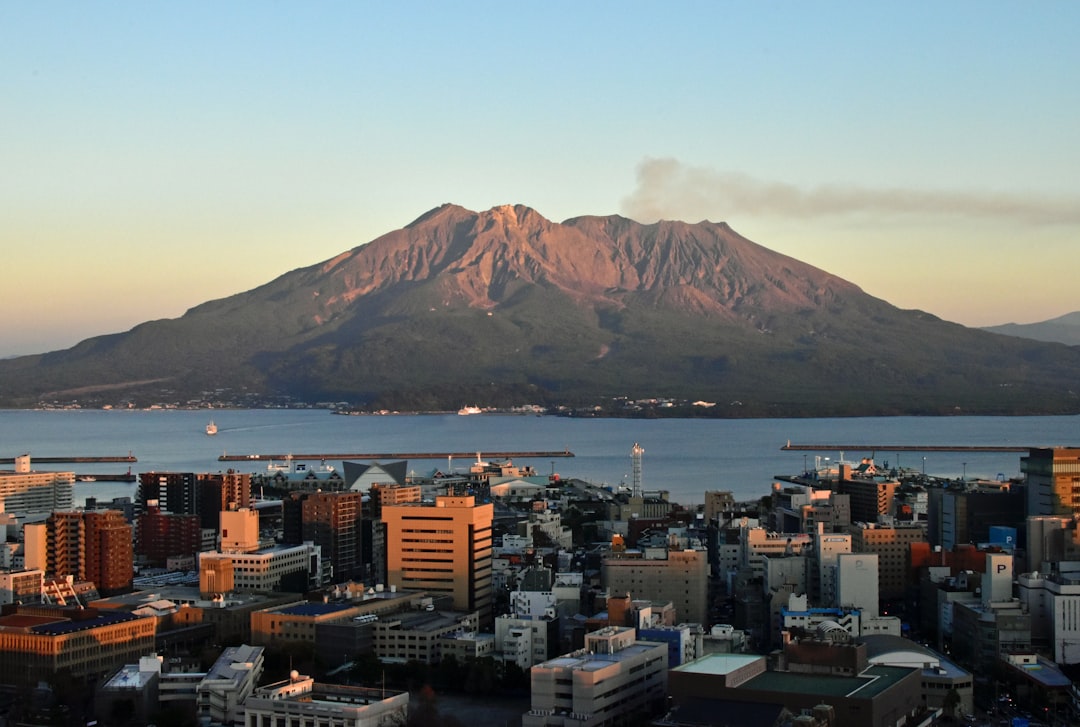 :sakurajima volcano smoking across the bay from kagoshima city