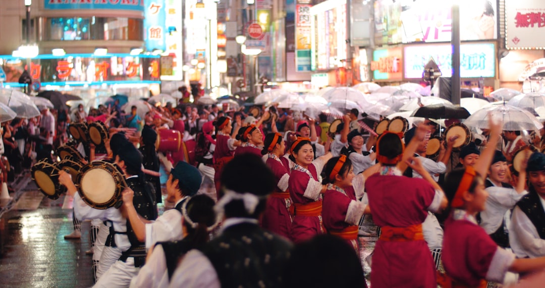 ：awa odori dancers performing in the streets of koenji tokyo