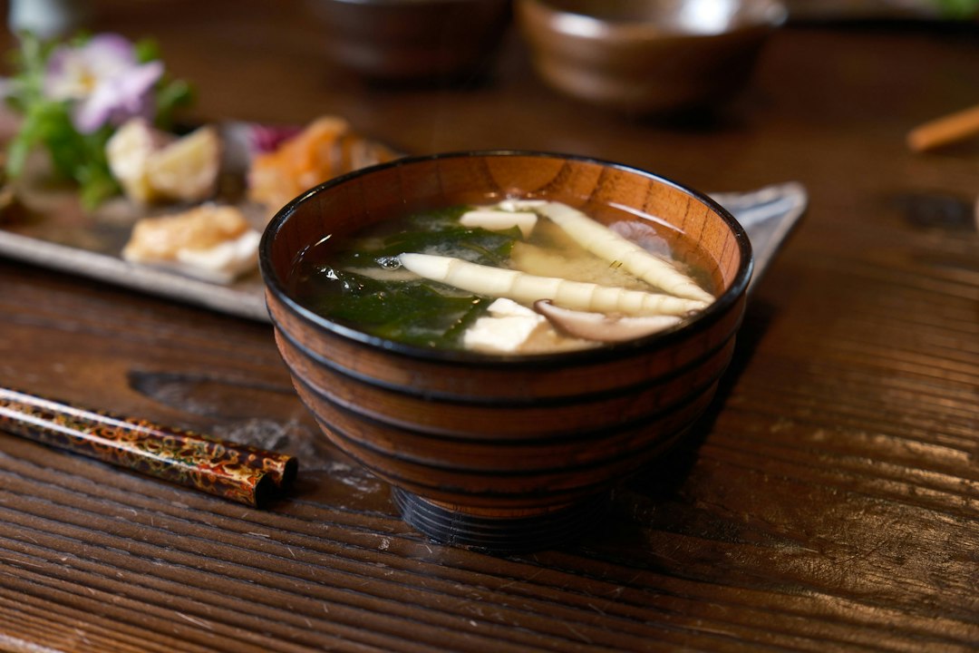 :what is miso soup a lacquer bowl with tofu wakame and green onion