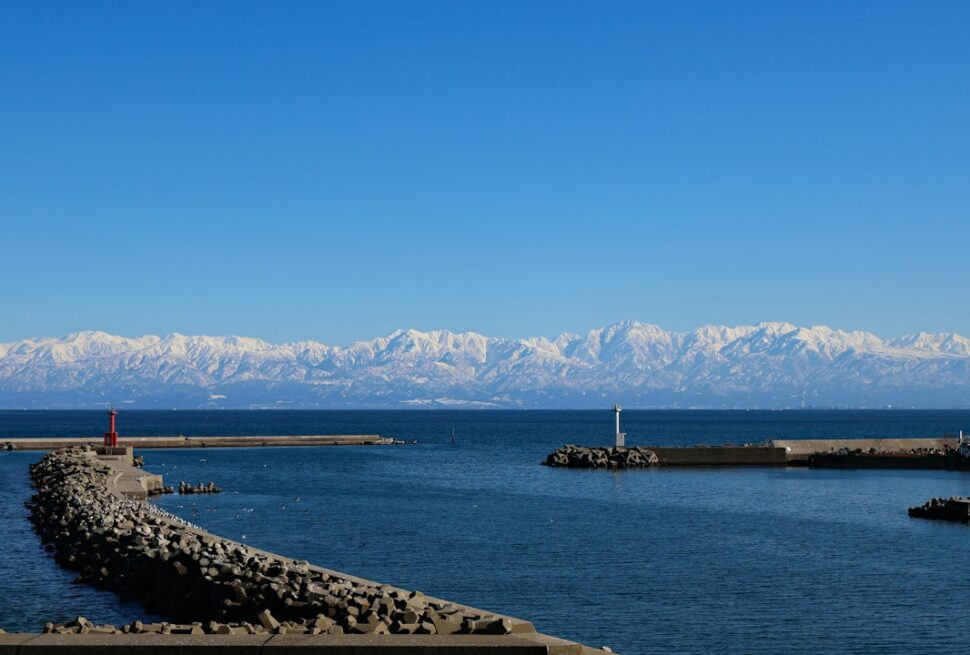 ：the tateyama range seen across toyama bay in toyama prefecture