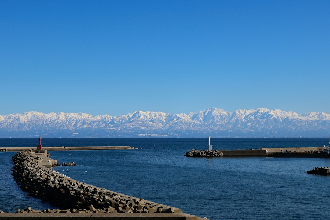 ：the tateyama range seen across toyama bay in toyama prefecture