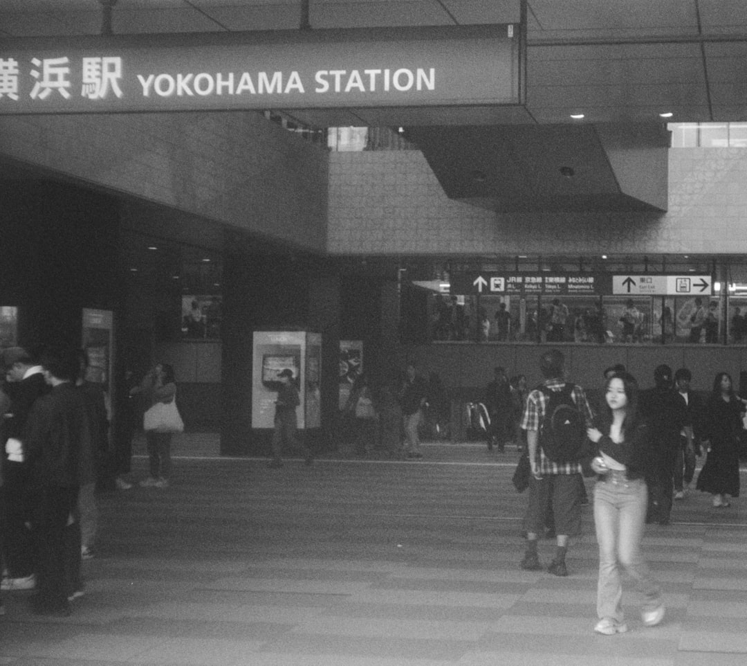 ：train arriving at yokohama station from tokyo
