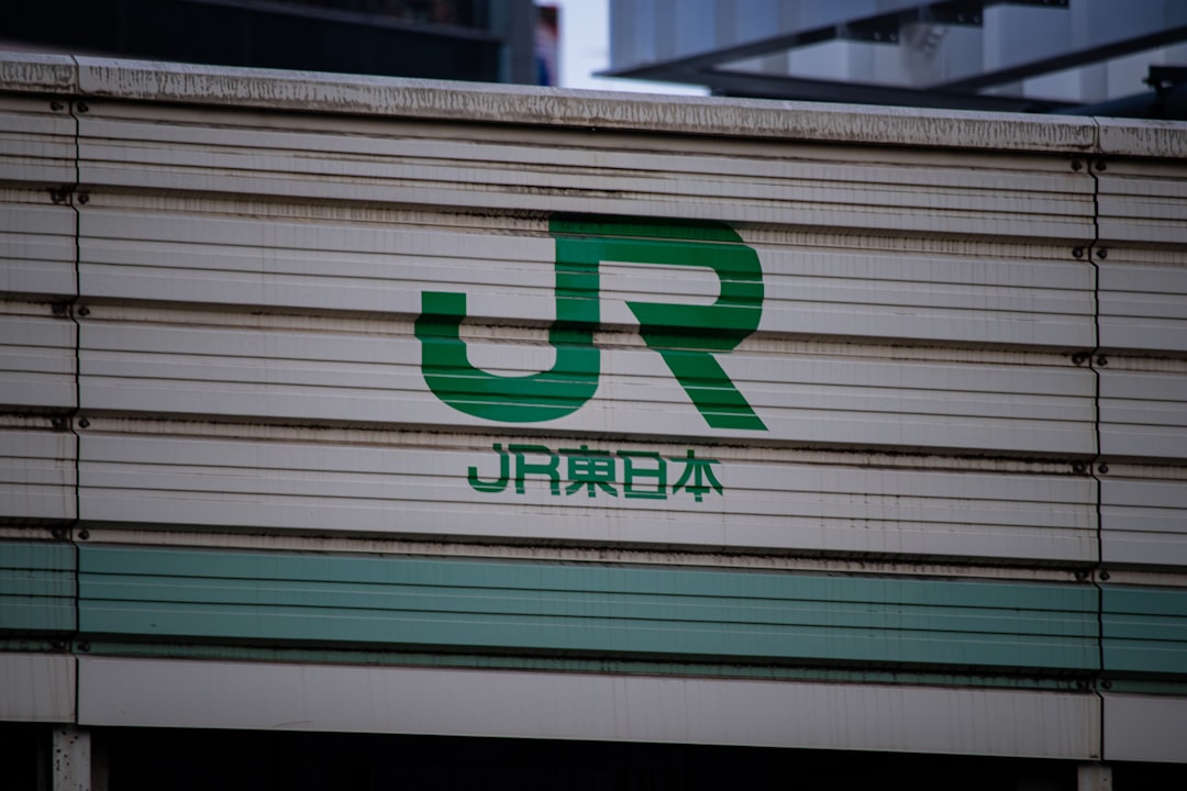 :yamanote line train at a tokyo station platform