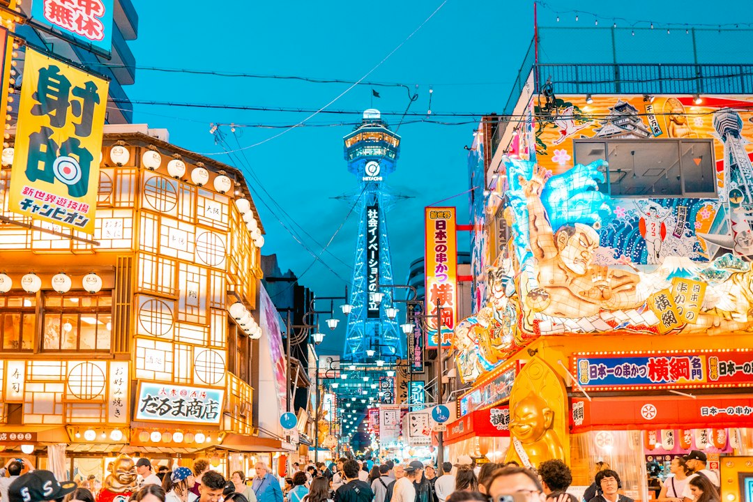 ：tsutenkaku tower above shinsekai at night in osaka