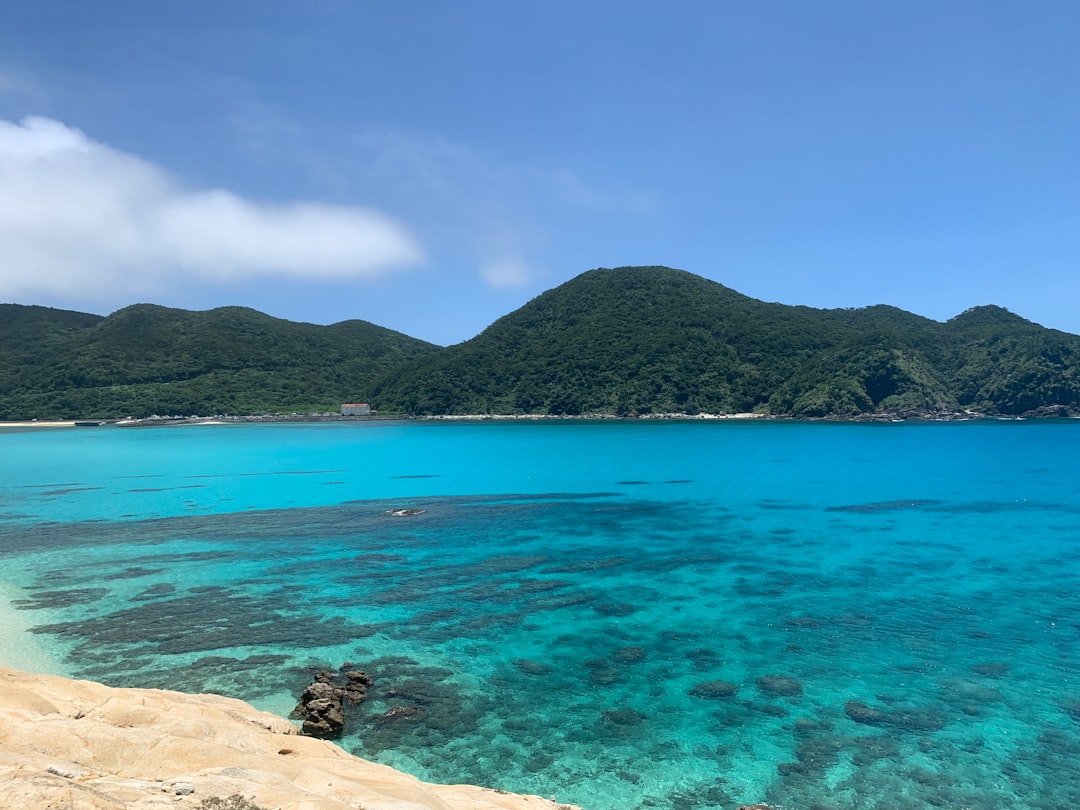 :white sand and clear turquoise water at yonaha maehama beach on miyakojima