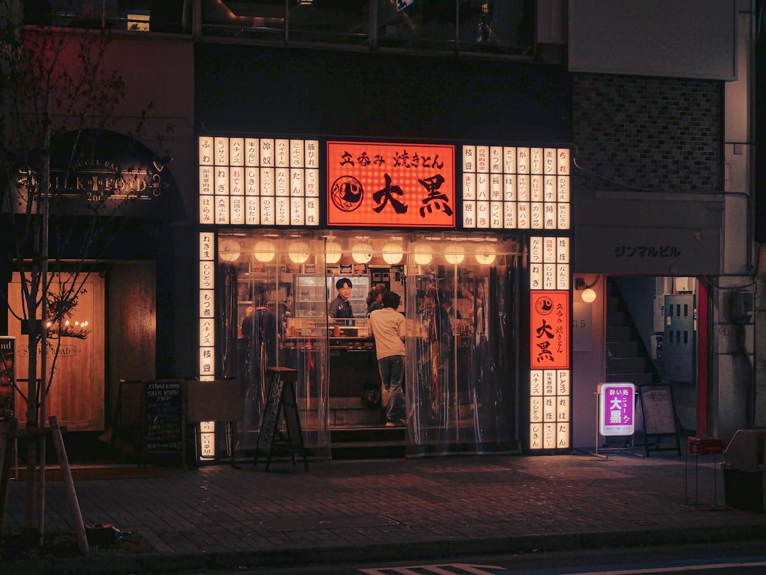 :ura namba backstreet izakaya entrances at night